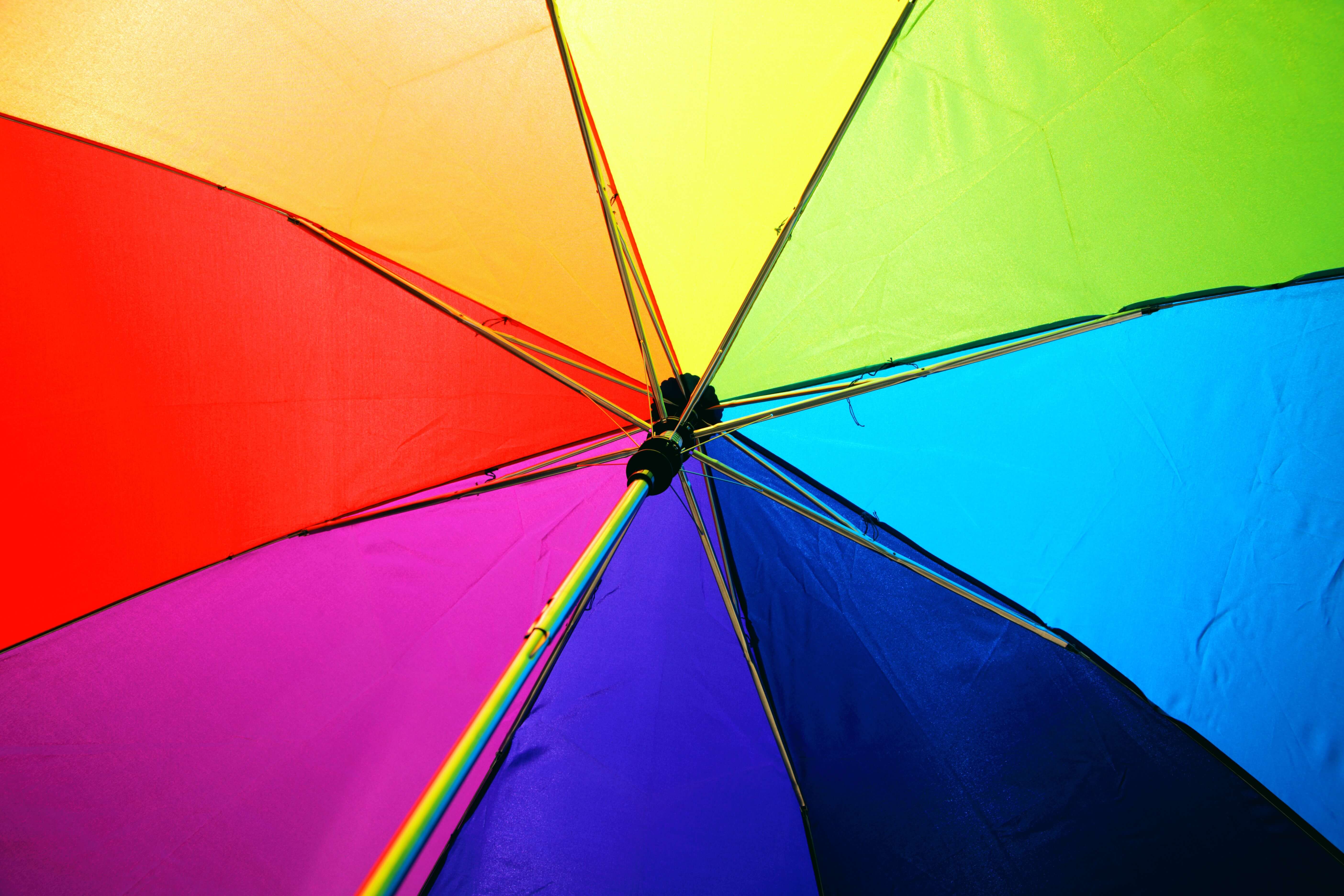Rainbow colored umbrella from underneath